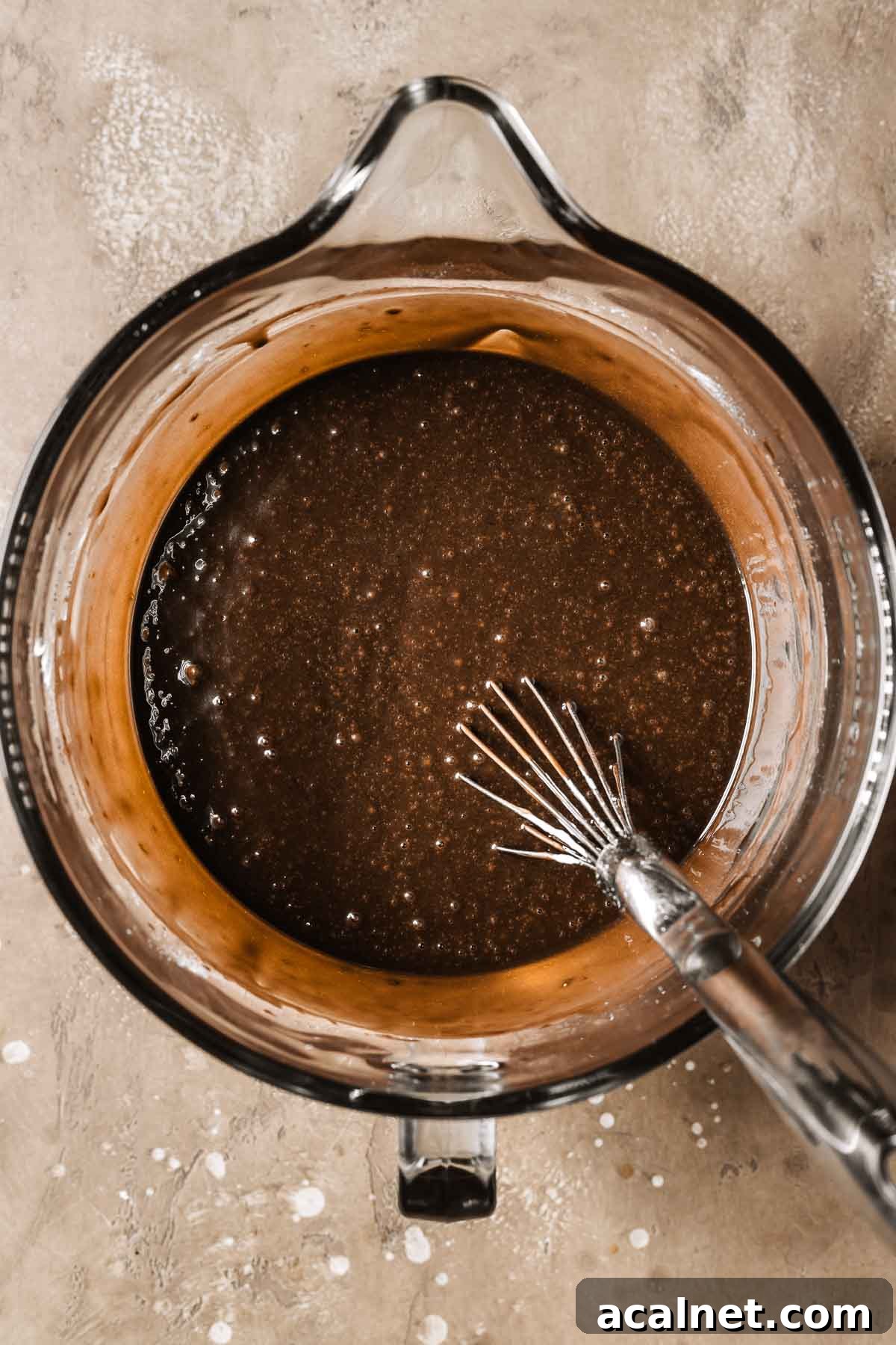Chocolate cake batter in a mixing bowl.