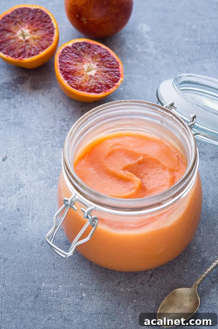 Vegan Blood Orange Curd Recipe — Silky, Zesty Spread 4 Vegan blood orange curd in a glass clip top jar with sliced blood oranges.