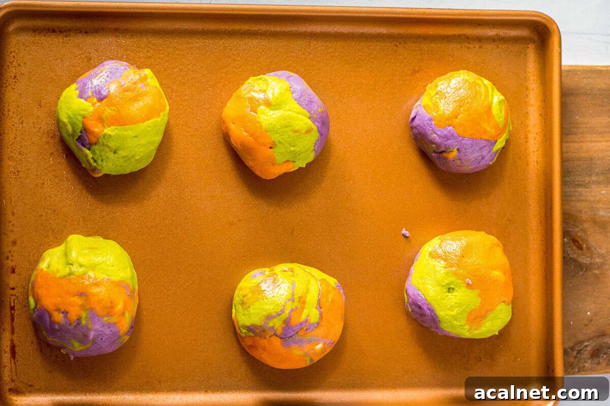 Halloween Sprinkle Cookie Recipe for Festive Party Treats 12 Colorful marbled Halloween cookie dough on a baking tray.