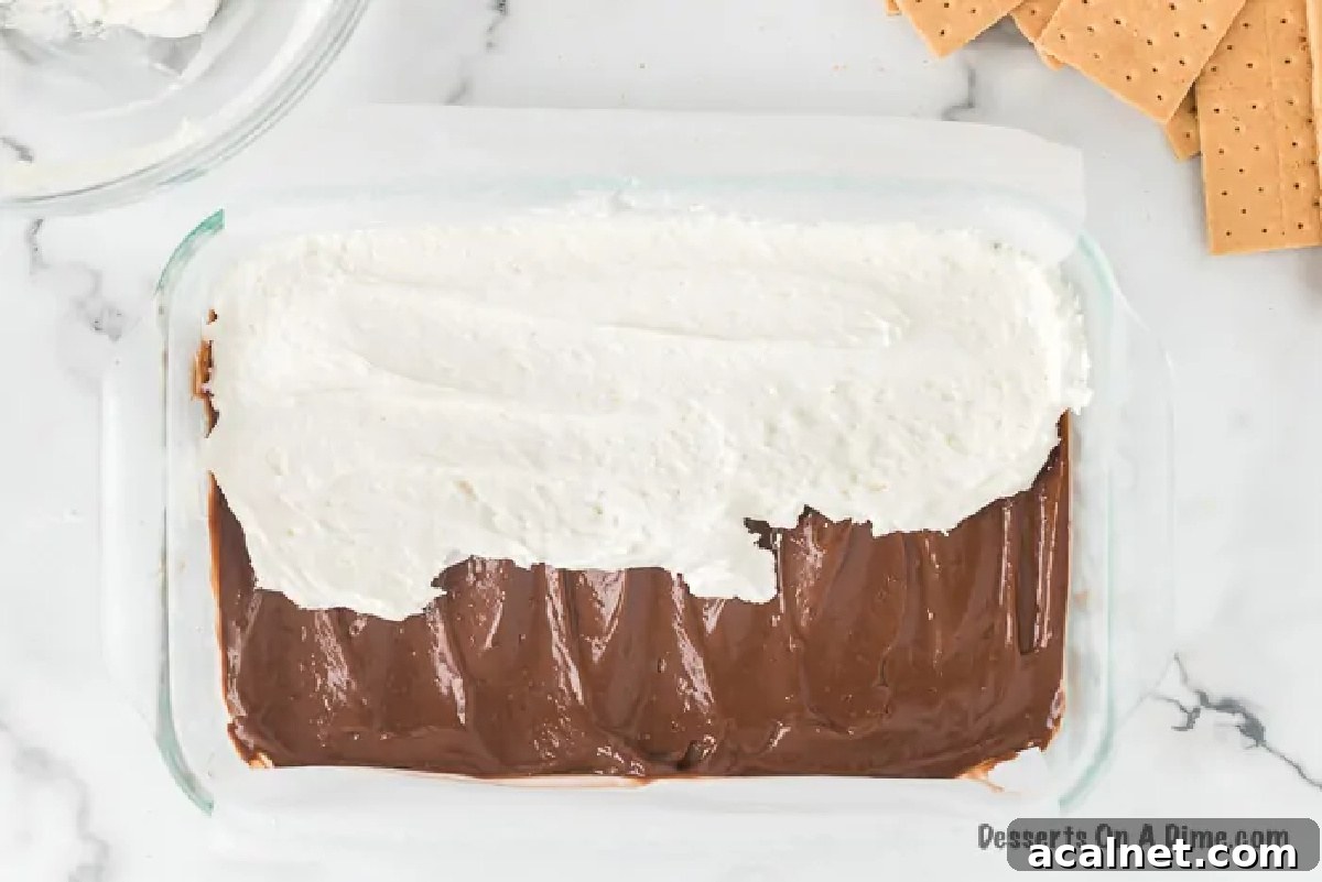 Marshmallow mixture spread over chocolate layer. 