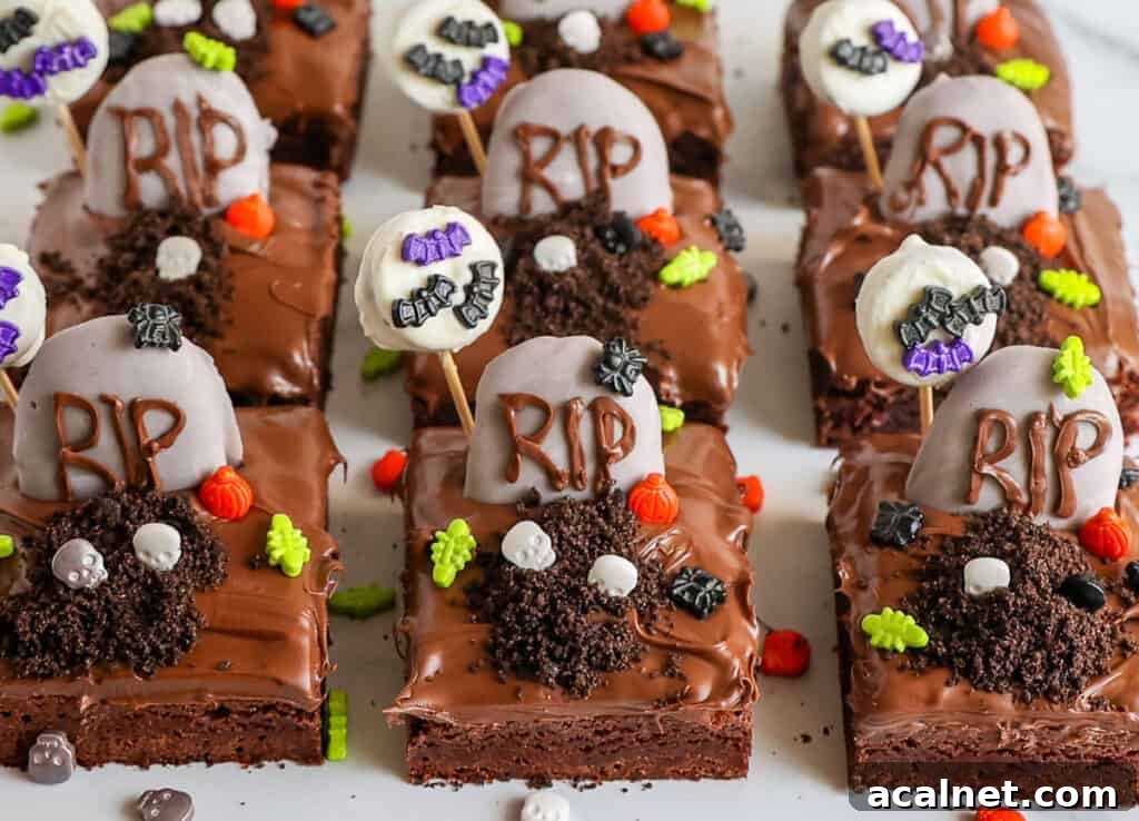 Brownies decorated with cookie gravestones, halloween themed sprinkles, and candy bats.