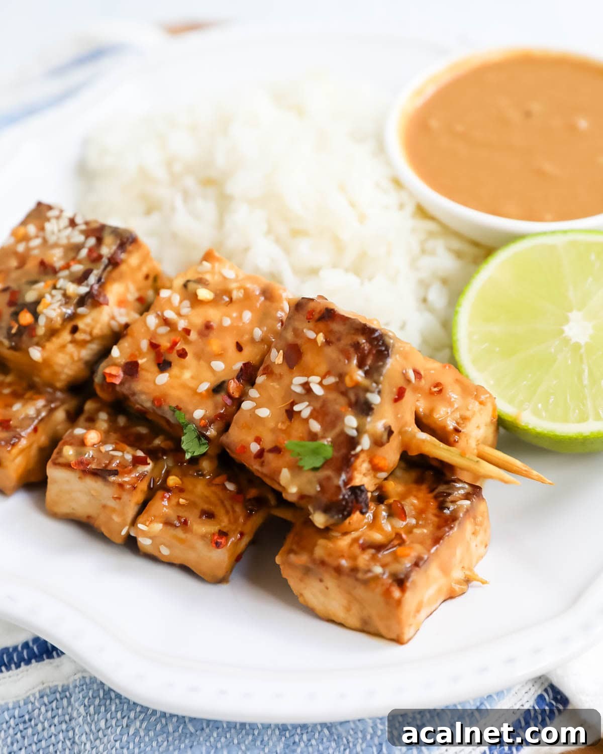 Thai peanut sauce on tofu skewers.