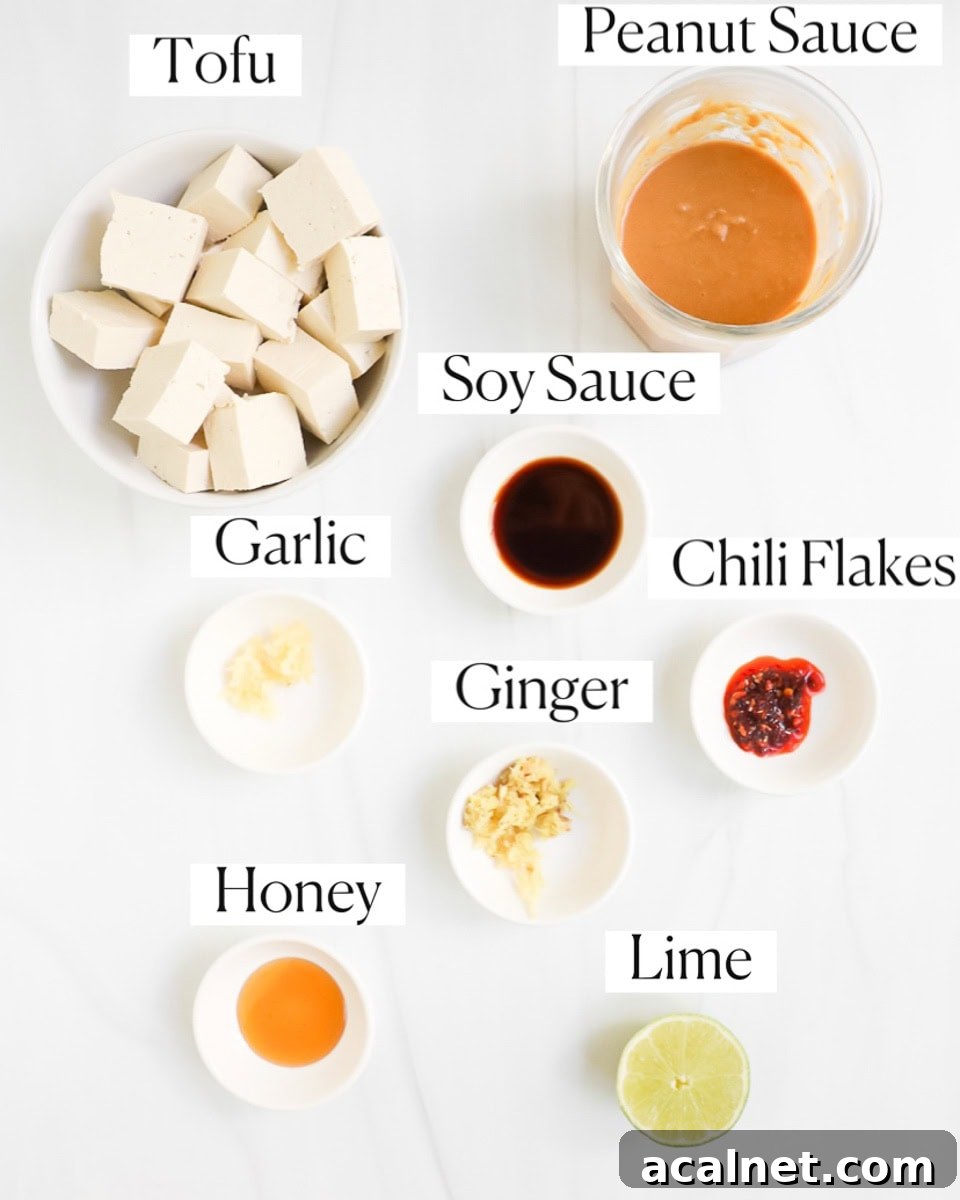 Ingredients for tofu satay in small white bowls.