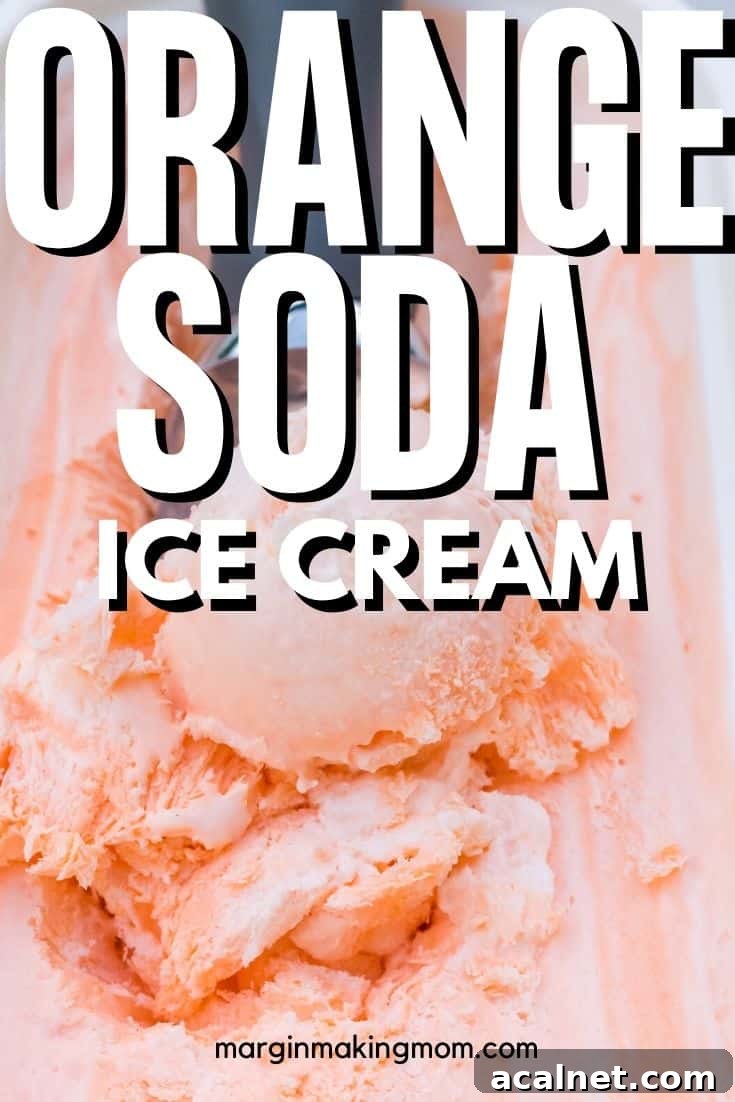 No-Churn Orange Creamsicle Ice Cream Recipe — Creamy Citrus Treat 7 freezer container of orange soda ice cream with an ice cream scoop removing a serving from the dish