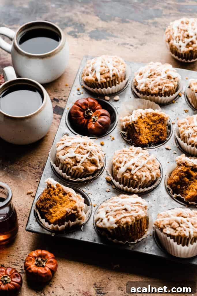 A vintage pan of the muffins on a wood surface.