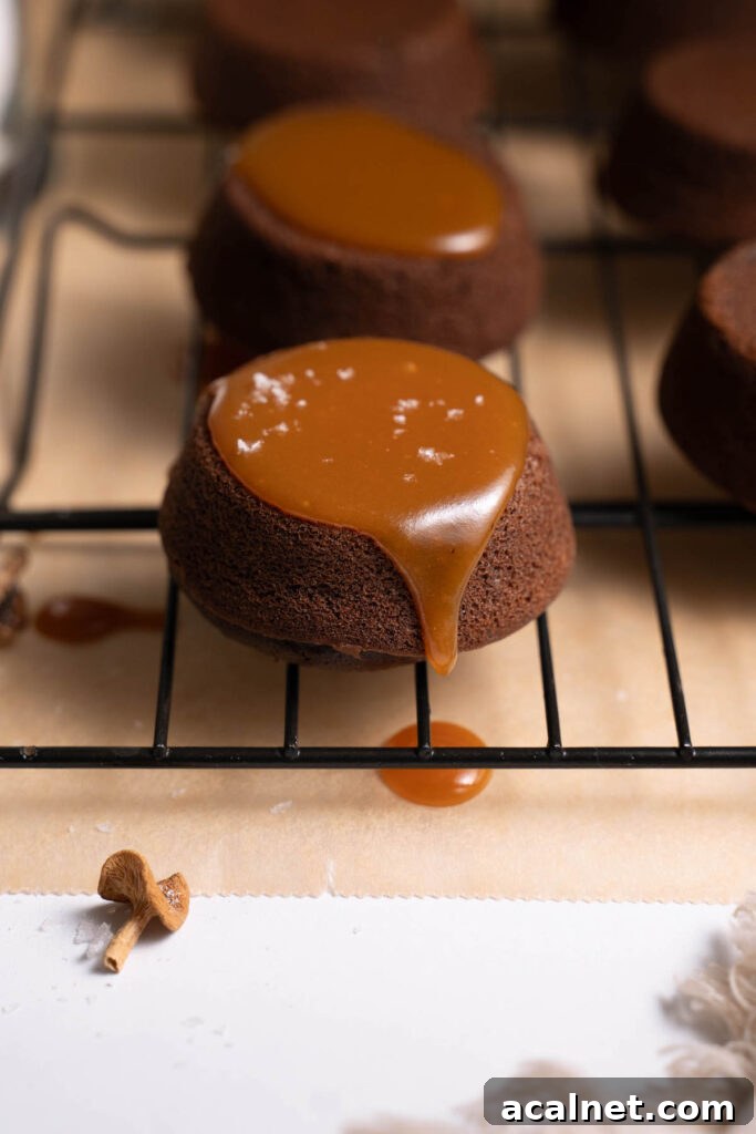Mini chocolate cake with candy cap caramel dripping off the side