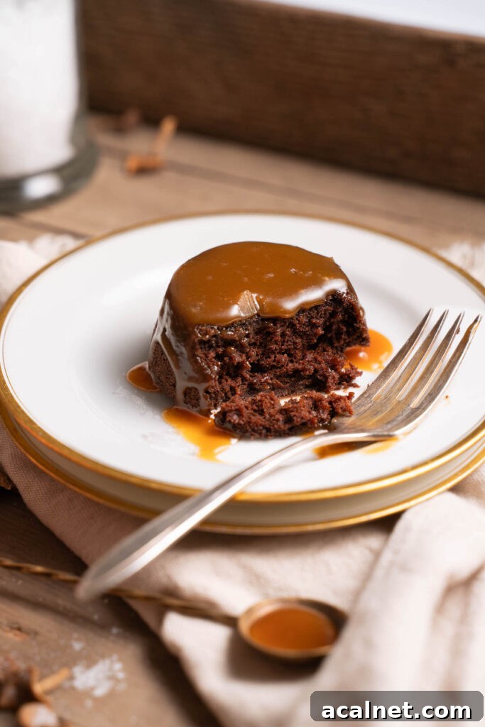 A mini chocolate caramel cake served up on a plate