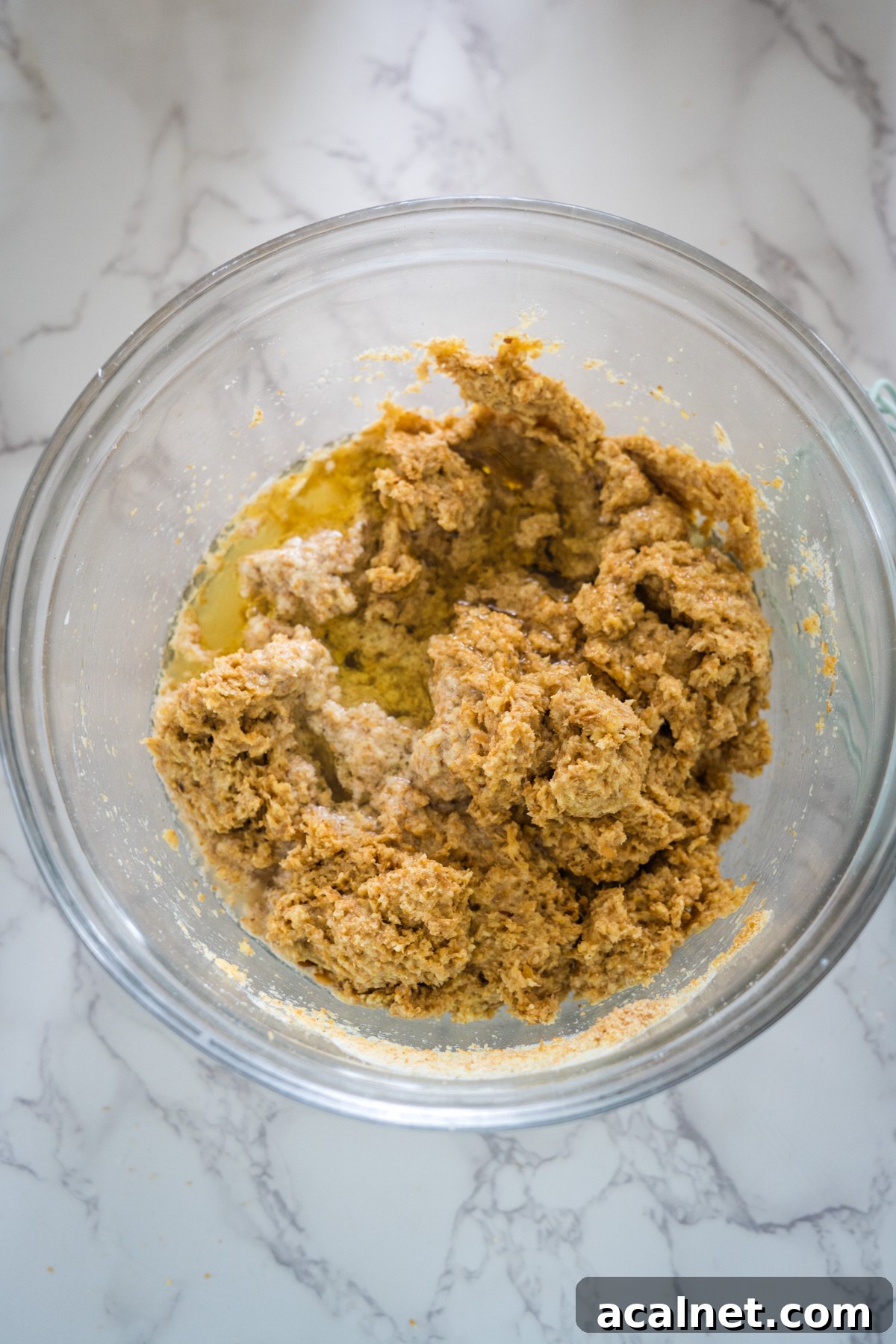A bowl filled with a mixture of flaxseed rolls and ingredients.
