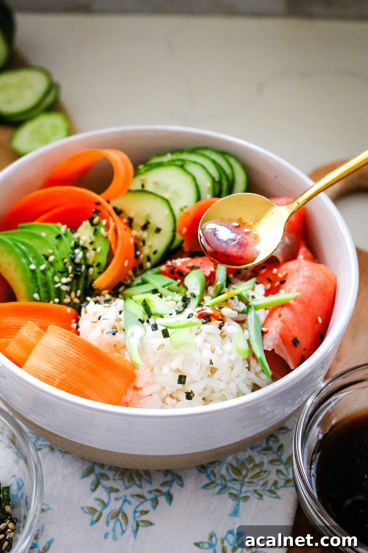 Smoked Salmon Poke Bowl with Avocado, Sesame and Lime 8 Smoked salmon in a white bowl, served with sesame seeds and soy sauce on the side.