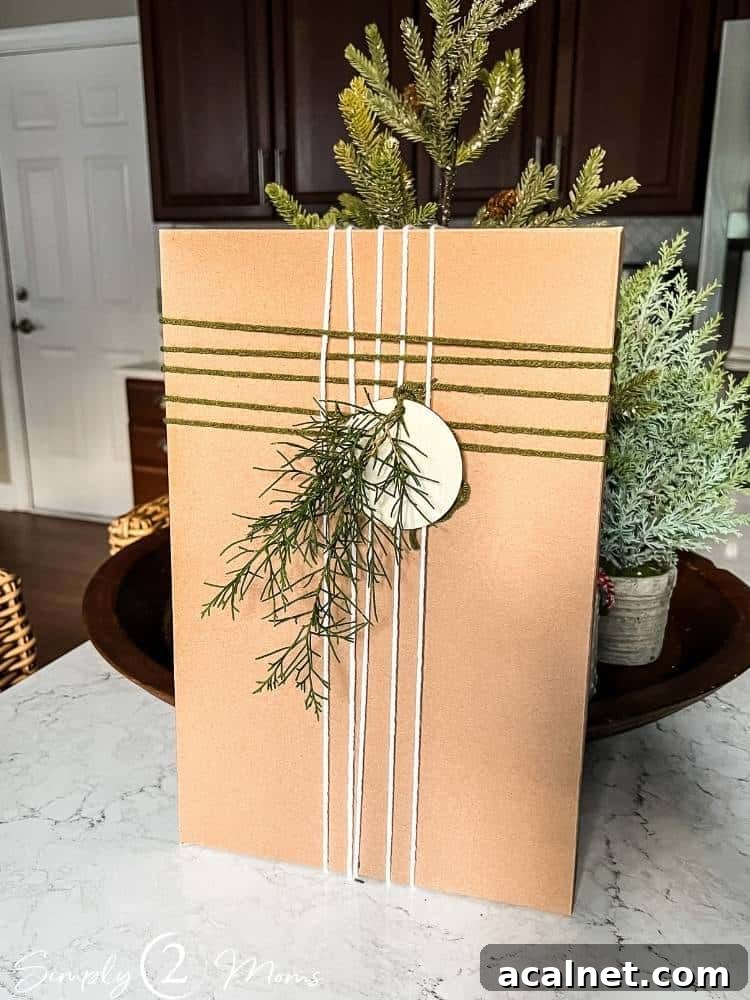 Kraft shirt box with two colors of yarn in a woven pattern and greenery