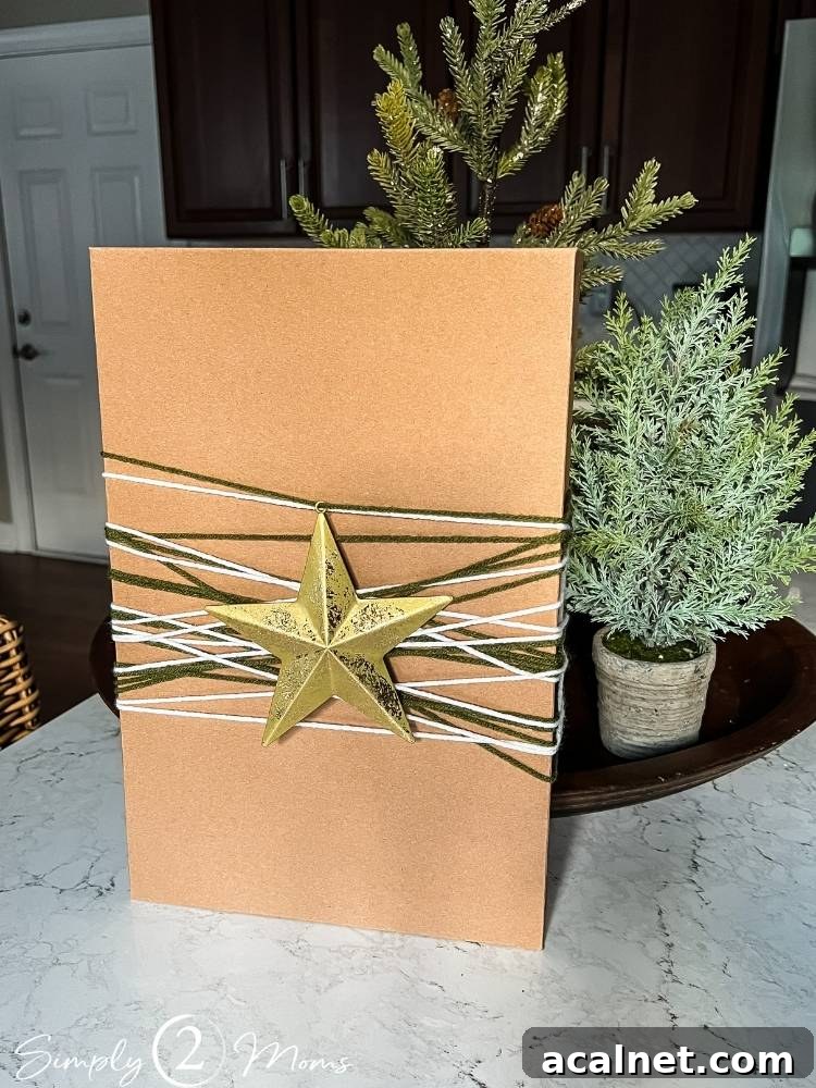 Kraft shirt box with layered yarn and a gold star ornament