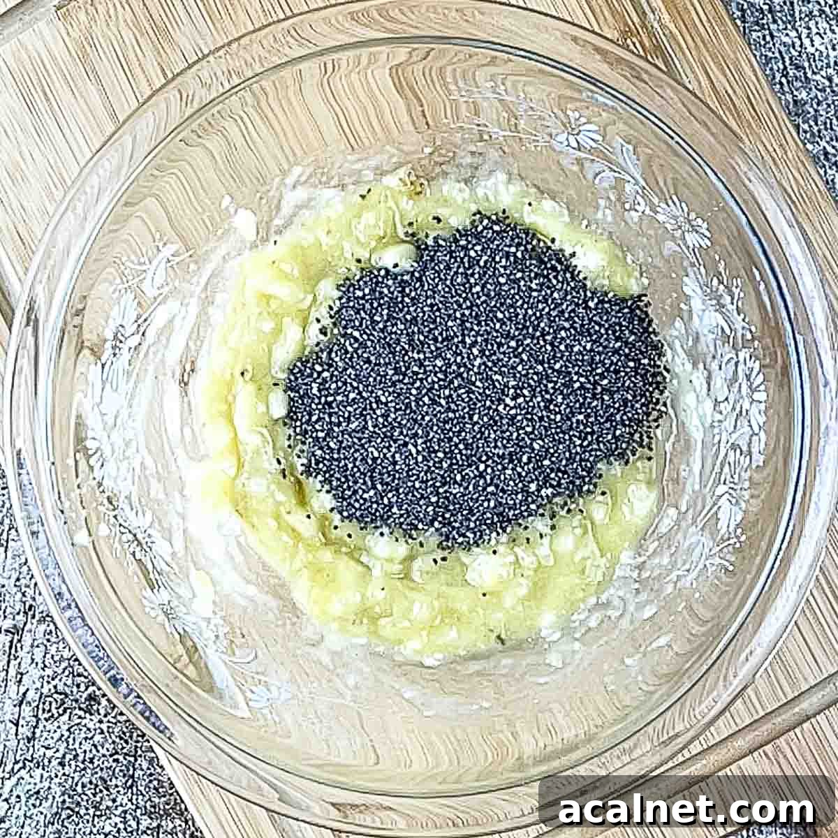 Creamy Banana Chia Seed Pudding Recipe 4 The mashed banana in a mixing bowl with chia seeds.