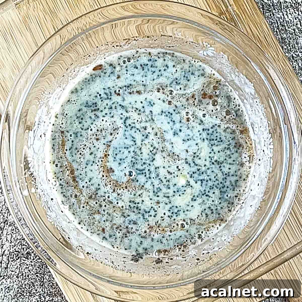 Creamy Banana Chia Seed Pudding Recipe 5 The milk, cinnamon, and maple syrup added to the bowl and mixed together.
