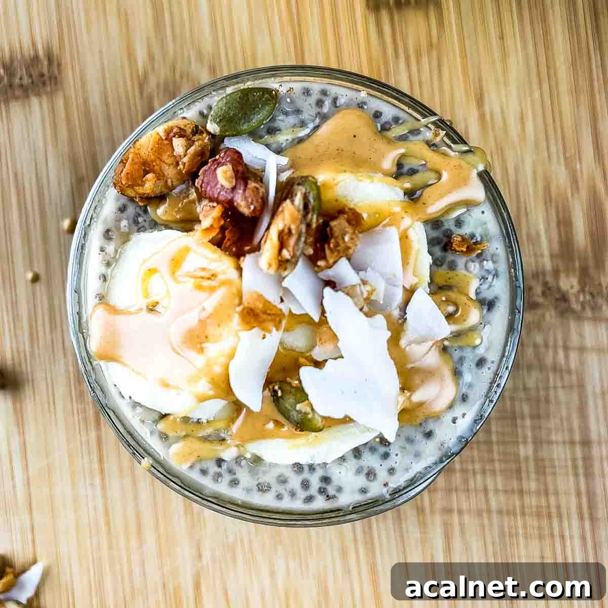 Creamy Banana Chia Seed Pudding Recipe 9 The chia pudding garnished with banana slices, peanut butter, and granola.