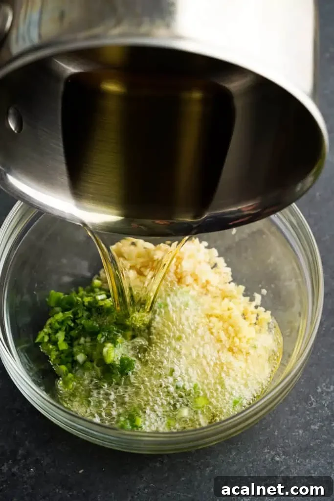 Crispy Air Fryer Potato Wedges Recipe 6 pouring oil over ginger scallion ingredients