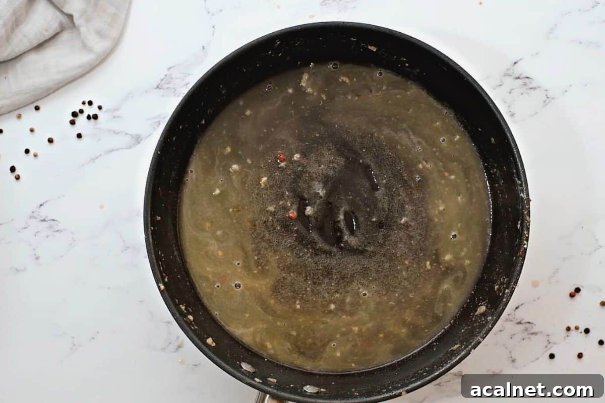 Butter and wine sauce in skillet.