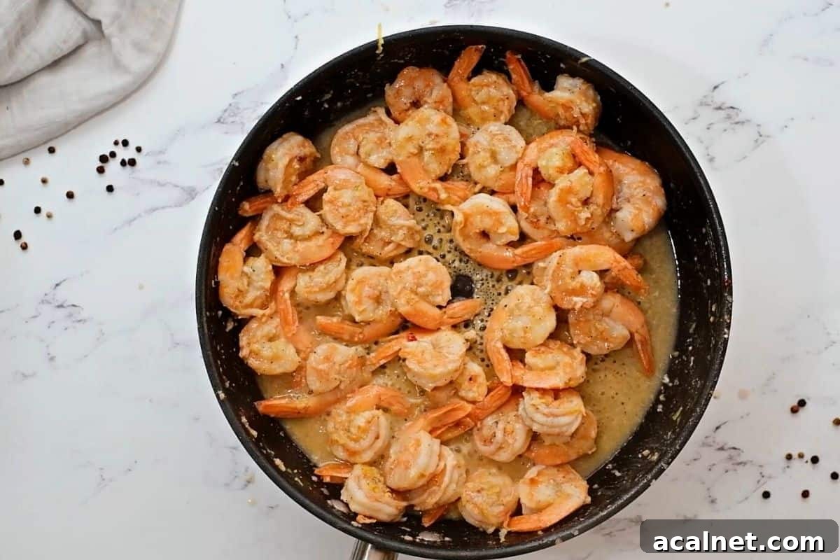Shrimp scampi in skillet.