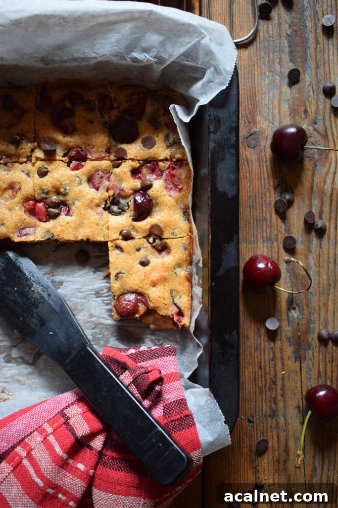 cherry blondies in a baking tin