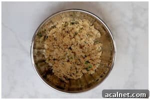 Onions with spices and breadcrumbs in a bowl.