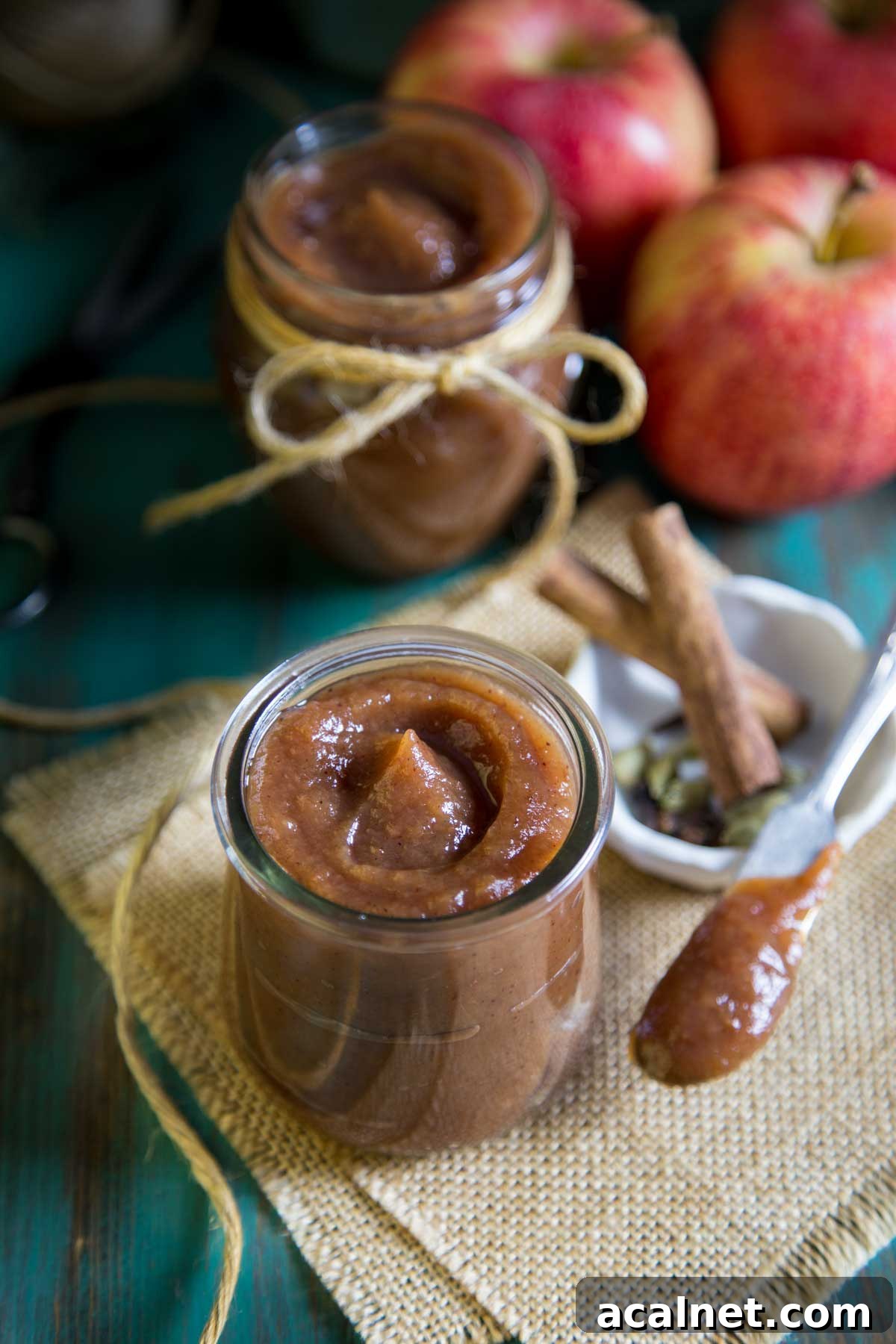 Slow Cooker Apple Butter Apple butter in a small glass jar.
