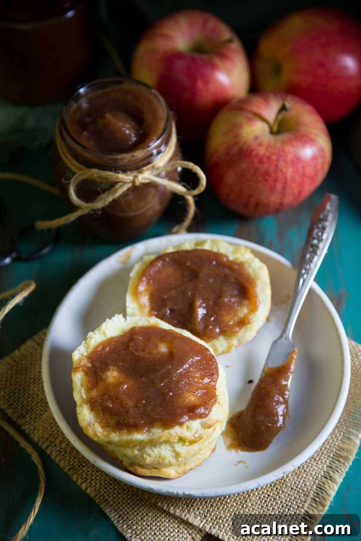 Slow Cooker Apple Butter Recipe: Homemade Fall Spread 4 Apple butter spread on a biscuit.