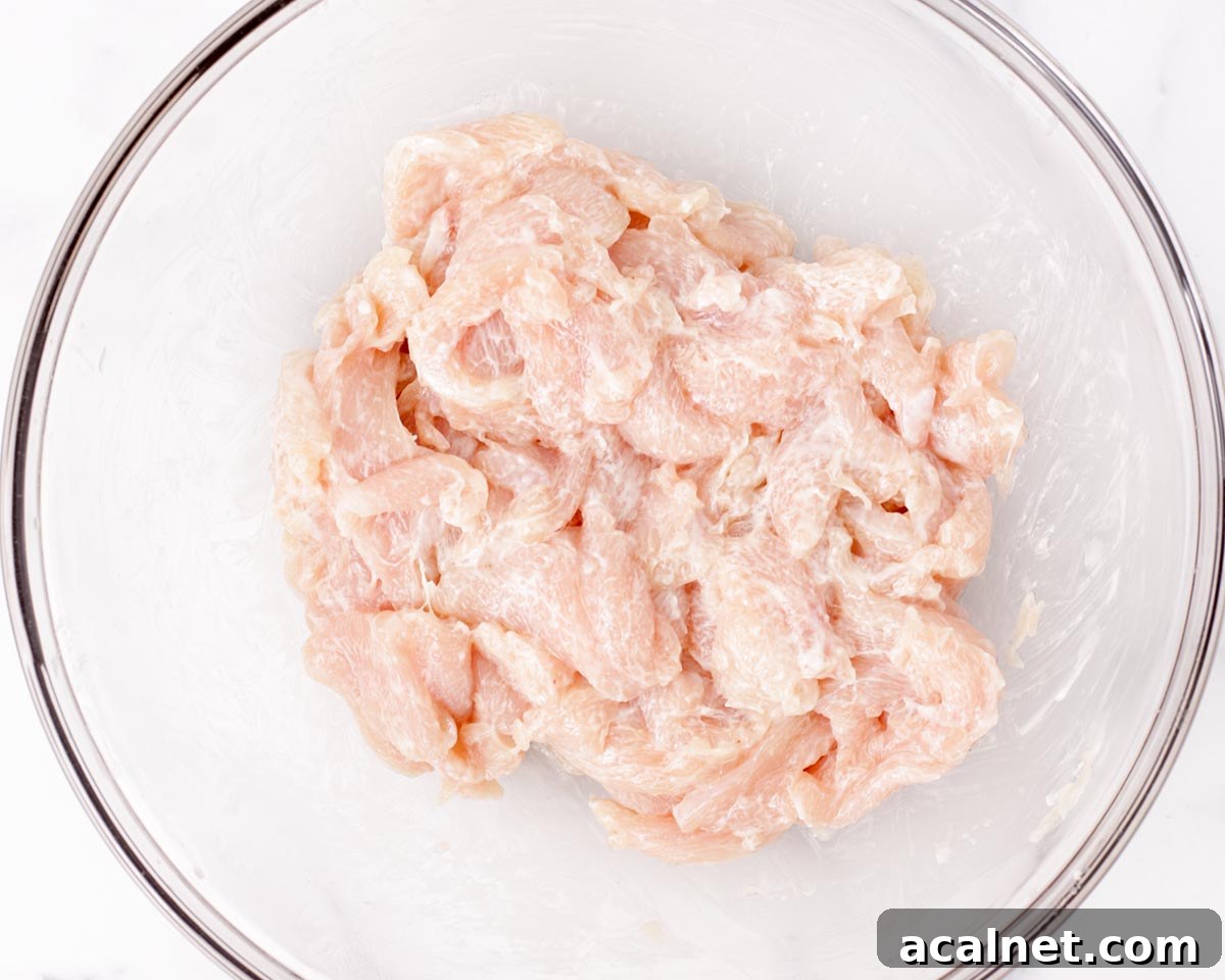 Chicken mixed and marinated.