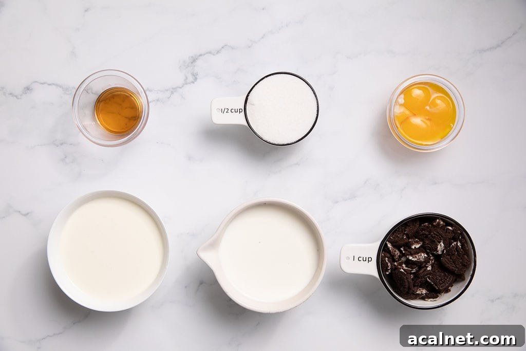 Ingredients laid out on a counter: egg yolks, milk, heavy cream, vanilla, sugar and oreo cookies