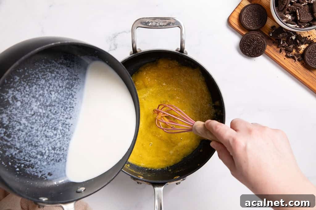 Egg yolks being tempered with warm milk.