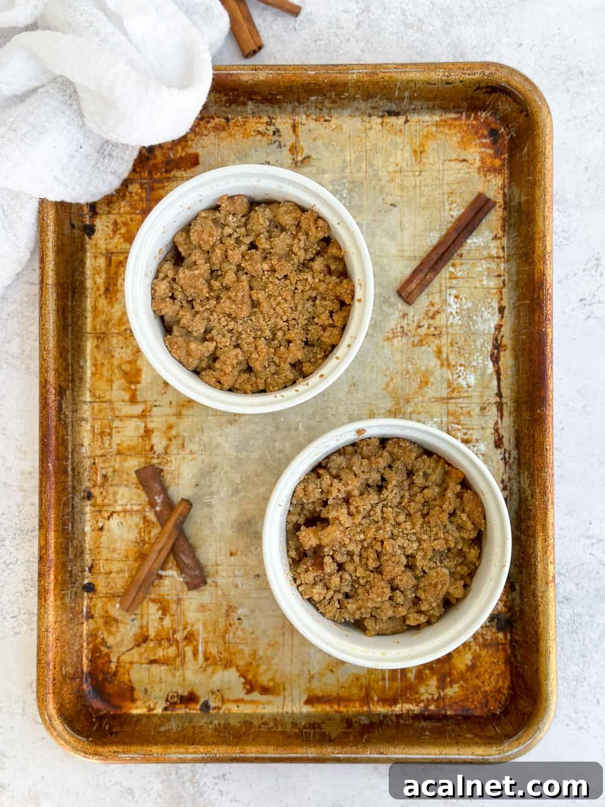 apple crumble for two on a baking sheet.