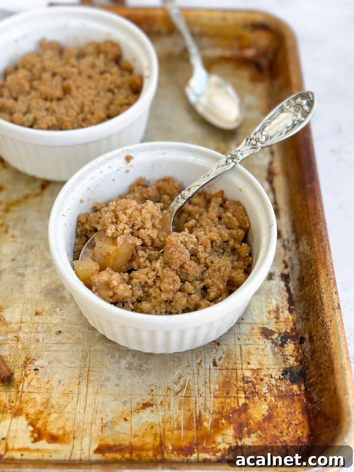 a side view of the apple crumble for two in the baking dish.