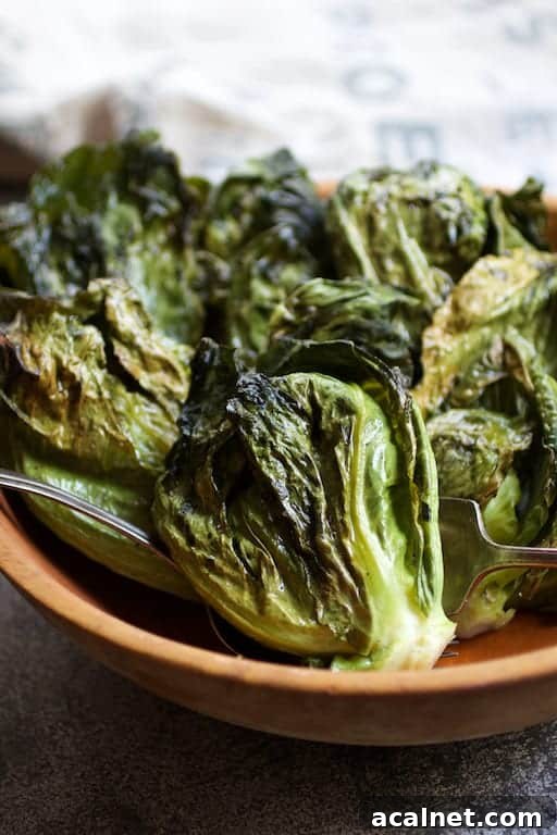 Close-up photo of Duck Fat Roasted Cabbage Sprouts in wooden bowl.