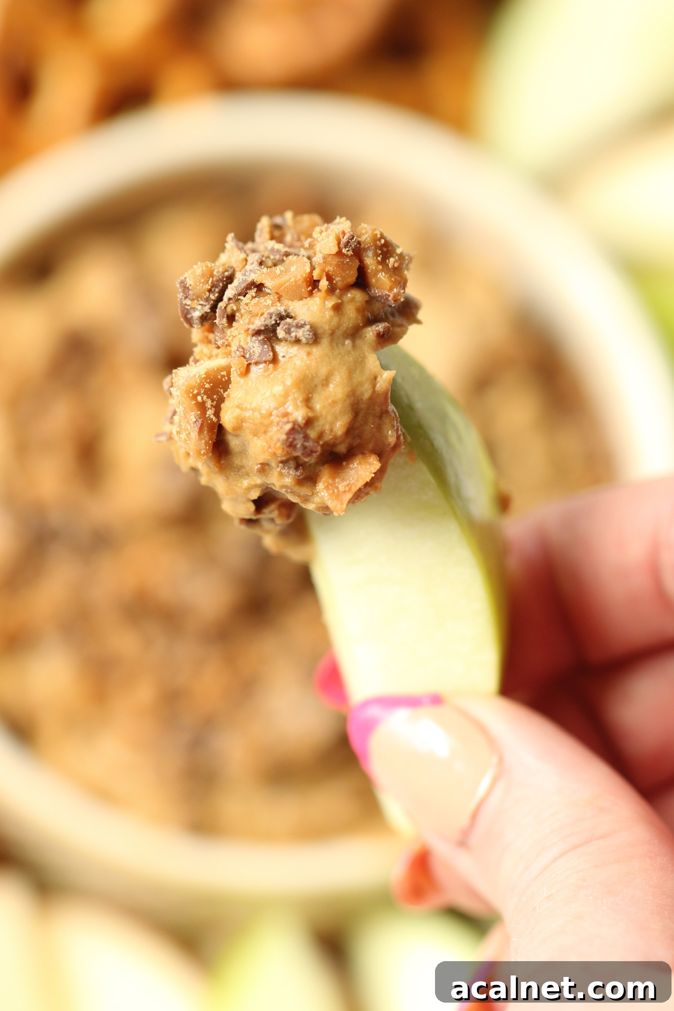 Dairy-free Toffee Apple Dip in a bowl with toffee sprinkled on top.