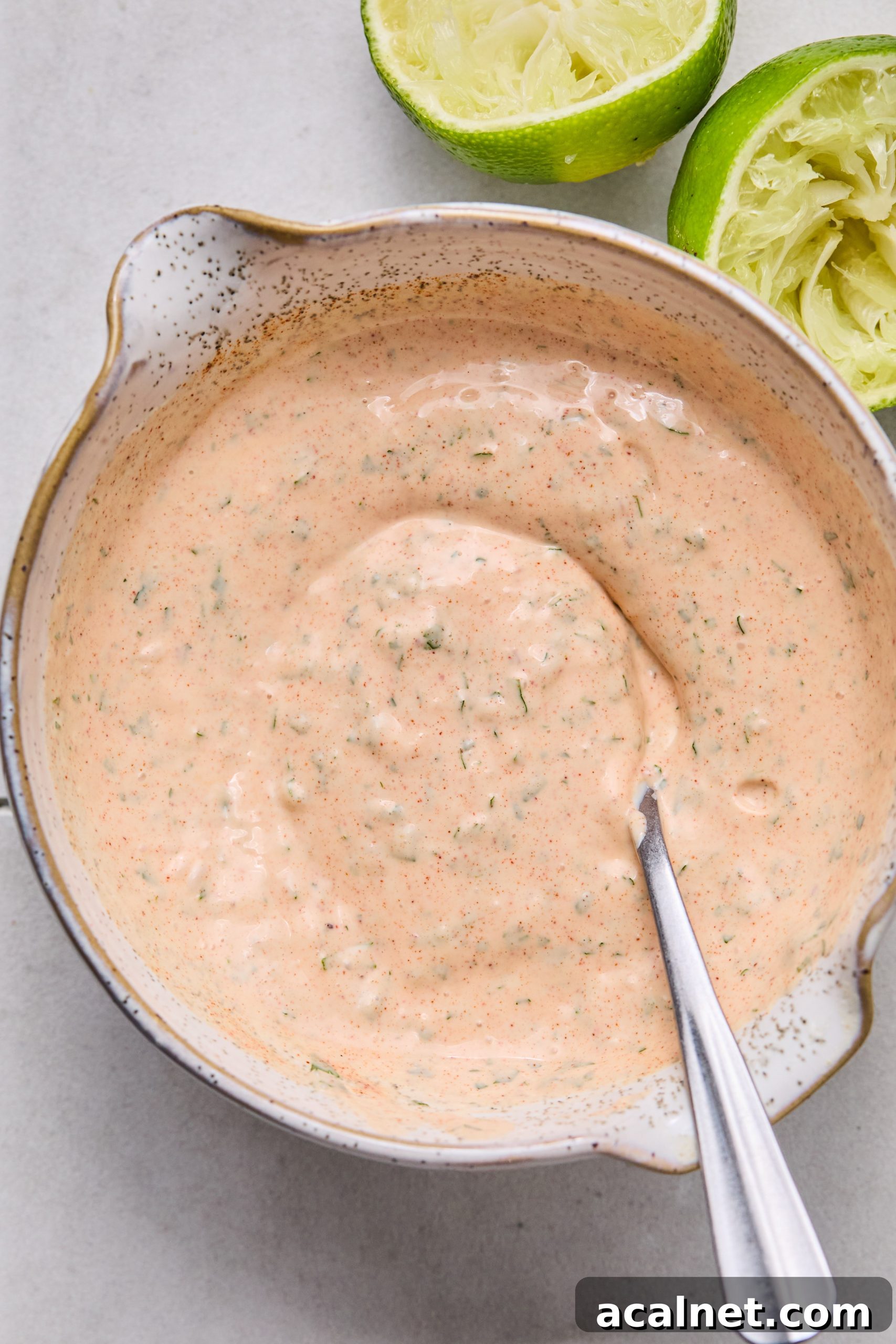 Smoky Chipotle Beef Burgers with Creamy Aioli 5 A small mixing bowl filled with homemade chipotle aioli