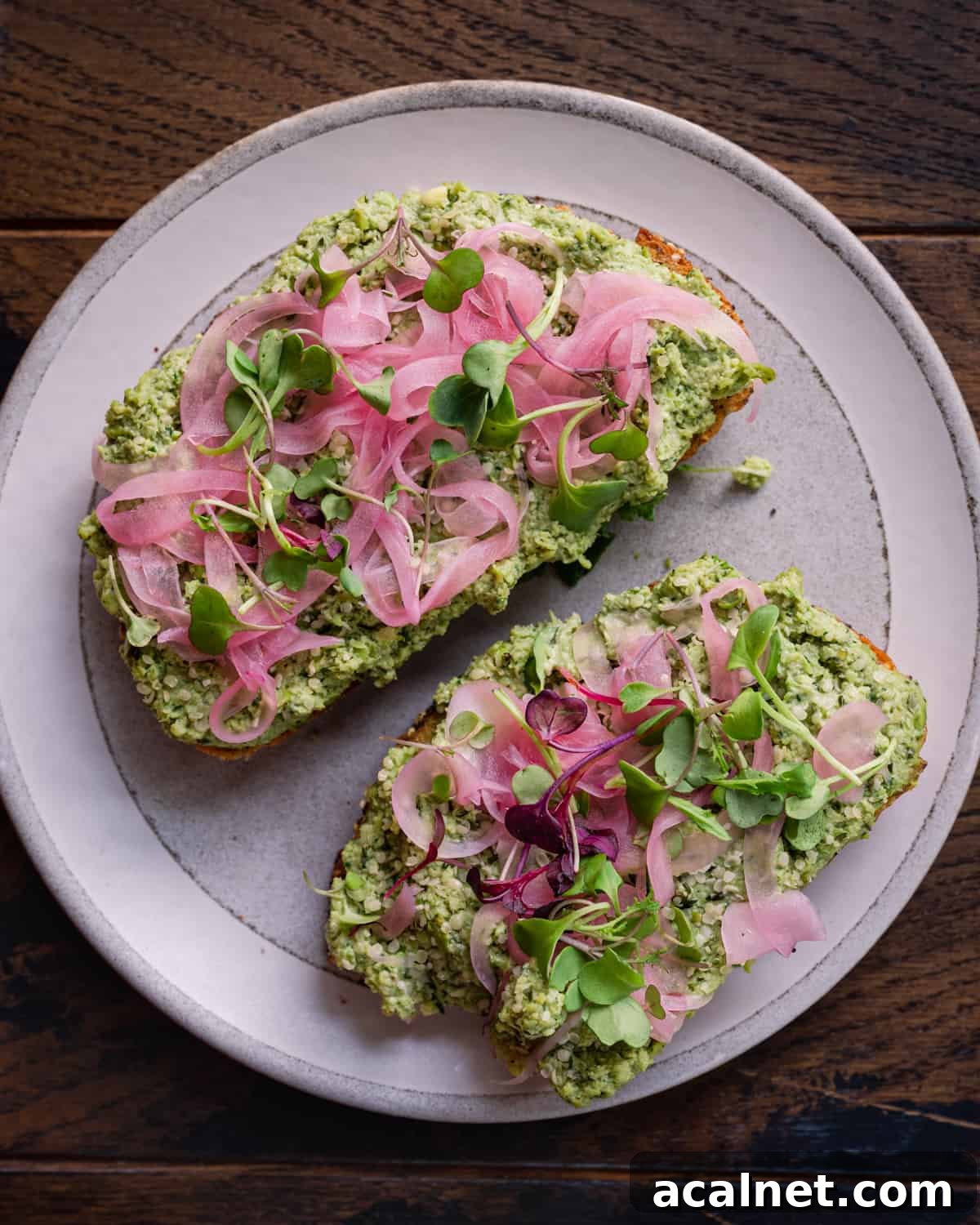 edamame smashed toast with pickled onions and microgreens.