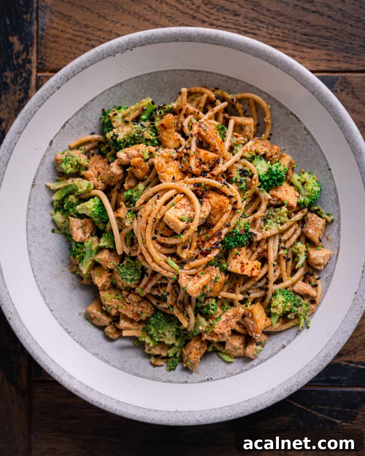 high protein tofu noodle bowl with almond butter sauce.