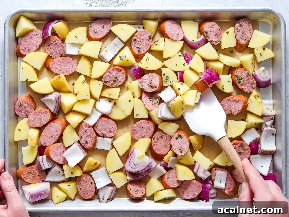 Sheet pan sausage and potatoes ready to bake