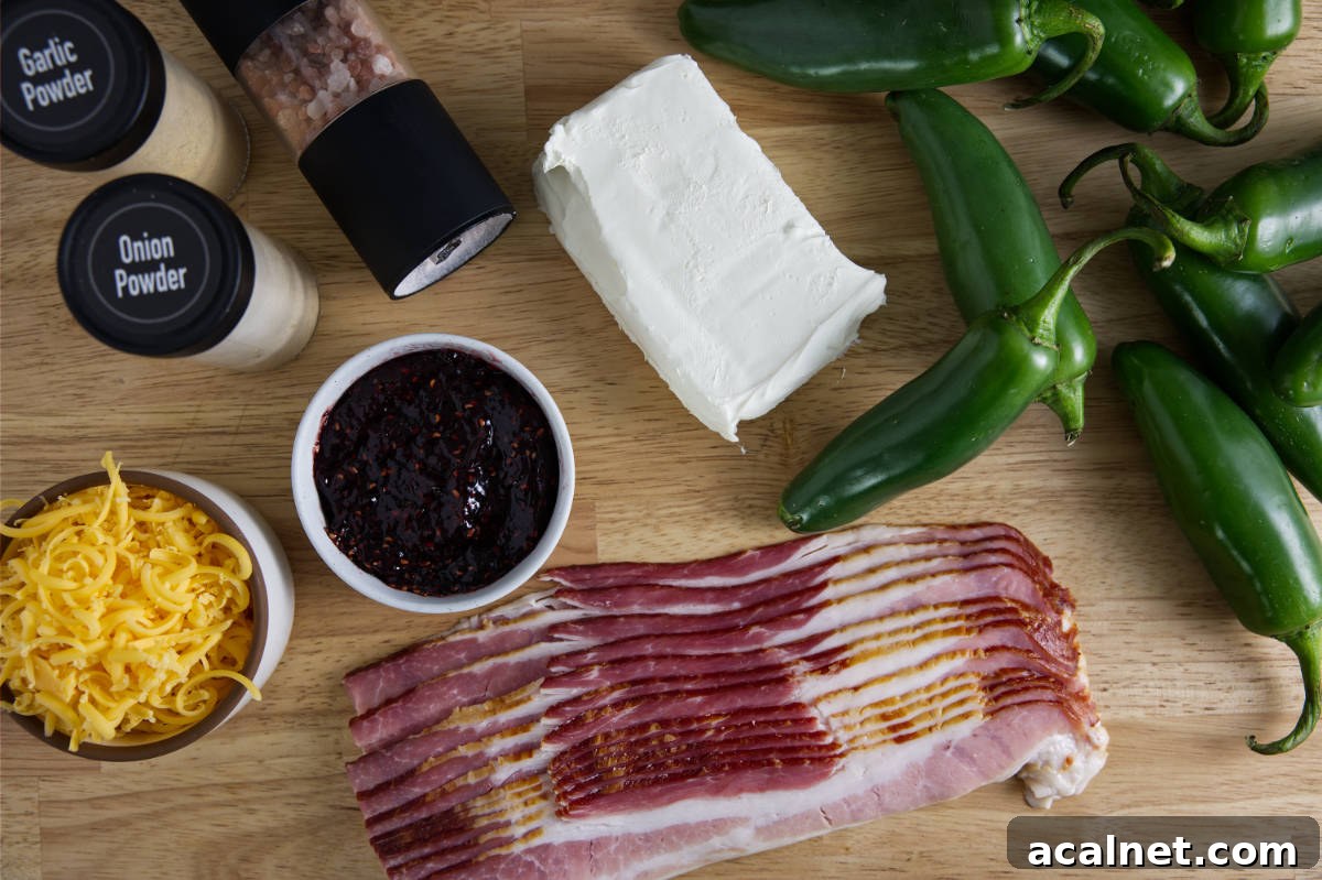 Ingredients for bacon wrapped jalapeño poppers in the air air fryer. Jalapeños, bacon, cream cheese, cheddar cheese, seasoning, and raspberry jam.