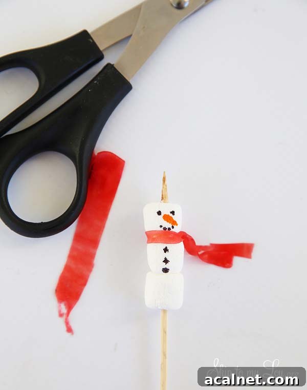 snowman stirrers add scarf