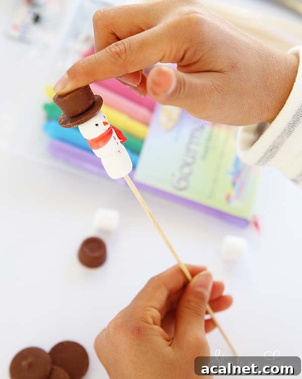 making snowman stirrers