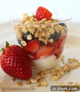 Berry parfait in a glass with fresh berries and granola