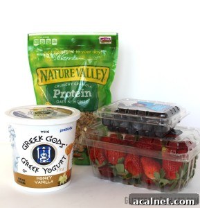 Stacked layers of yogurt, berries, and granola