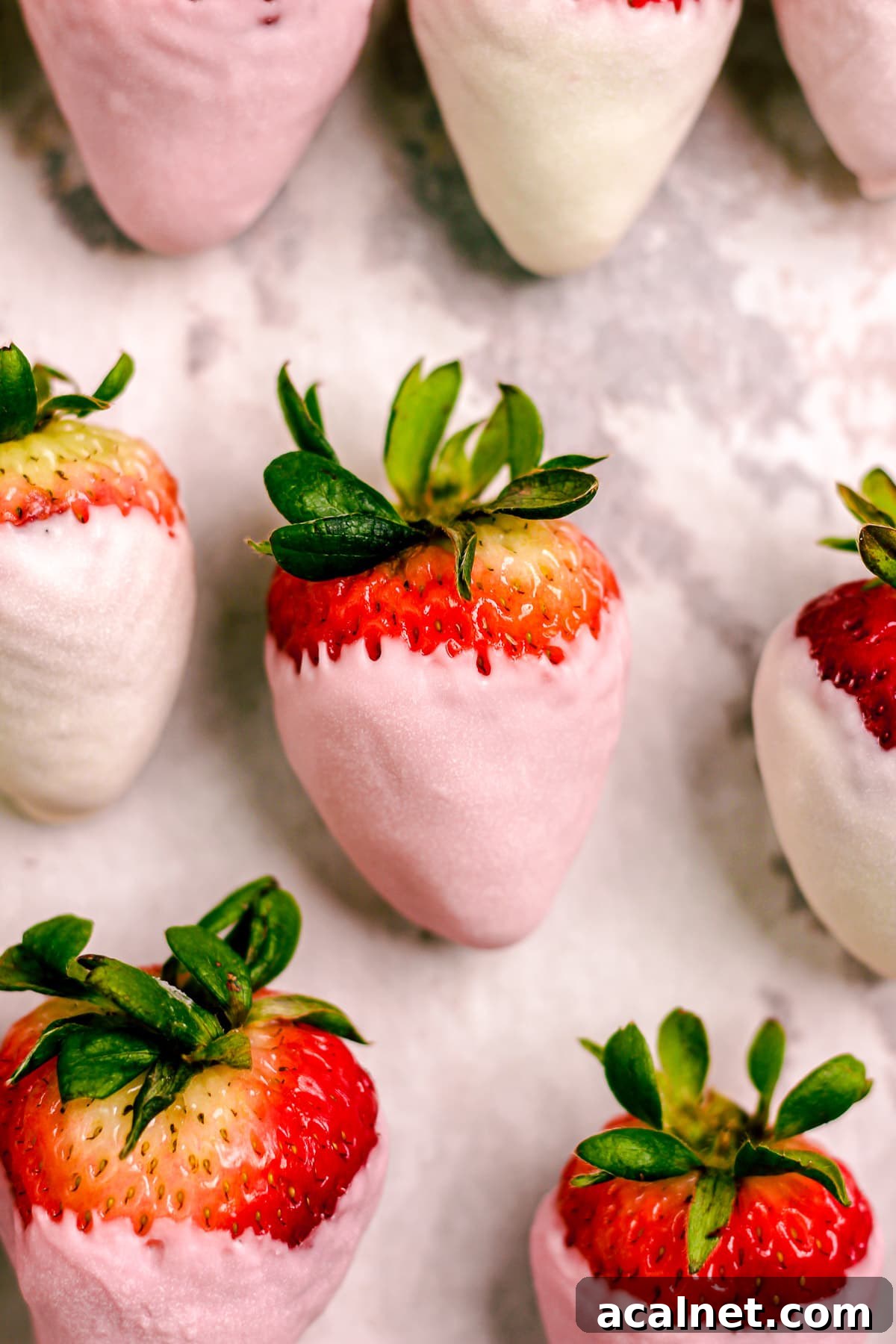 Close up of pink chocolate dipped strawberries