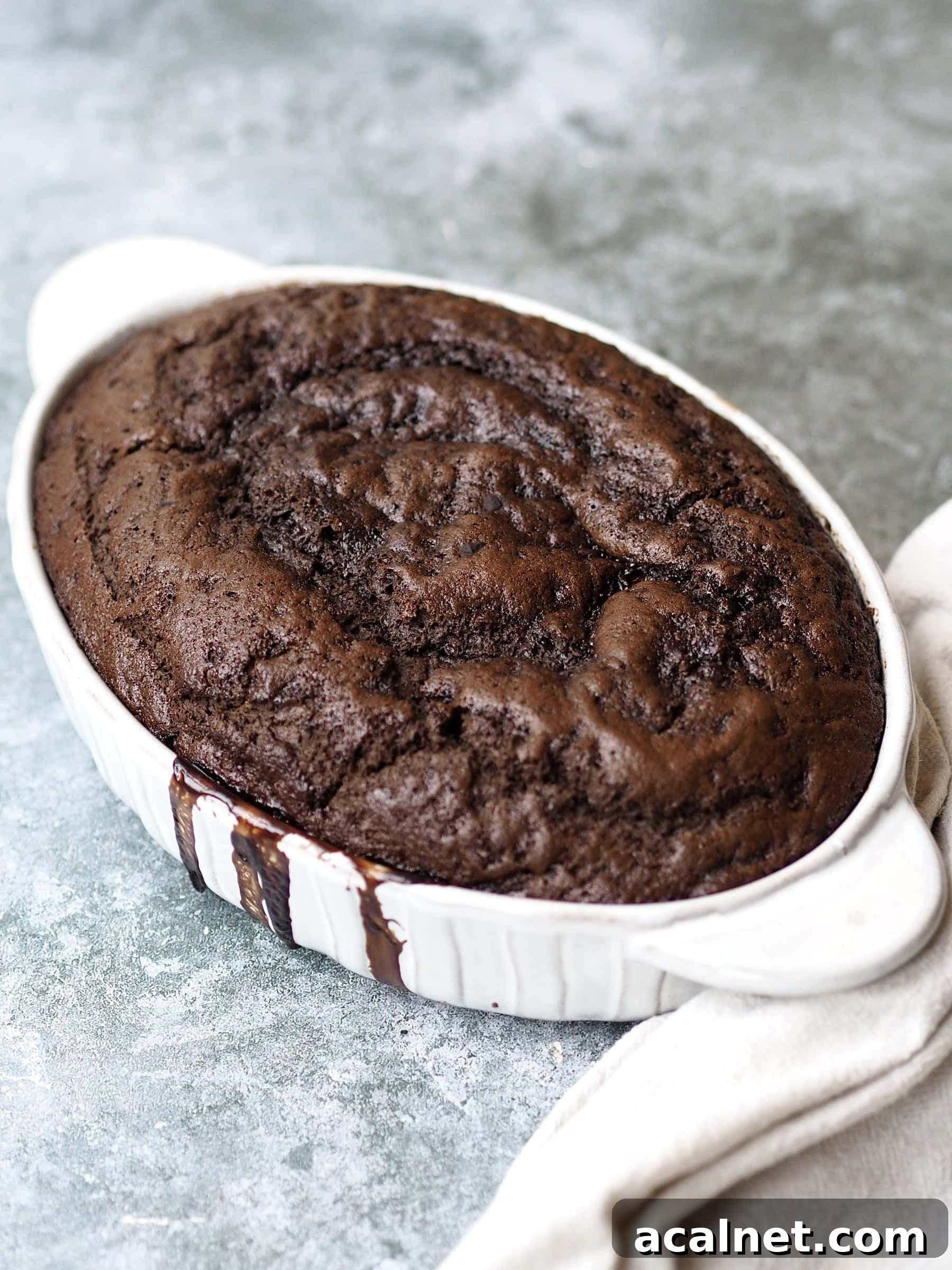 baked Self Saucing Chocolate Pudding in a white baking dish.