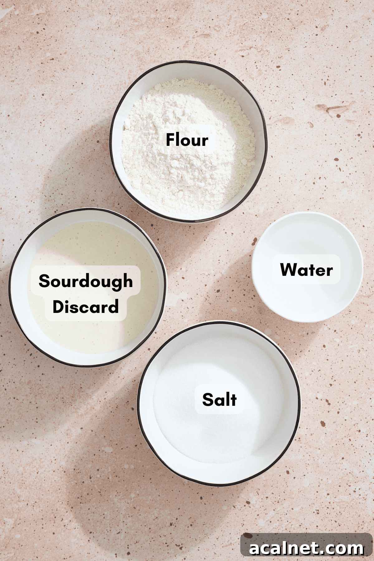 Ingredients for Sourdough Discard Salt Dough Ornaments in small bowls. 