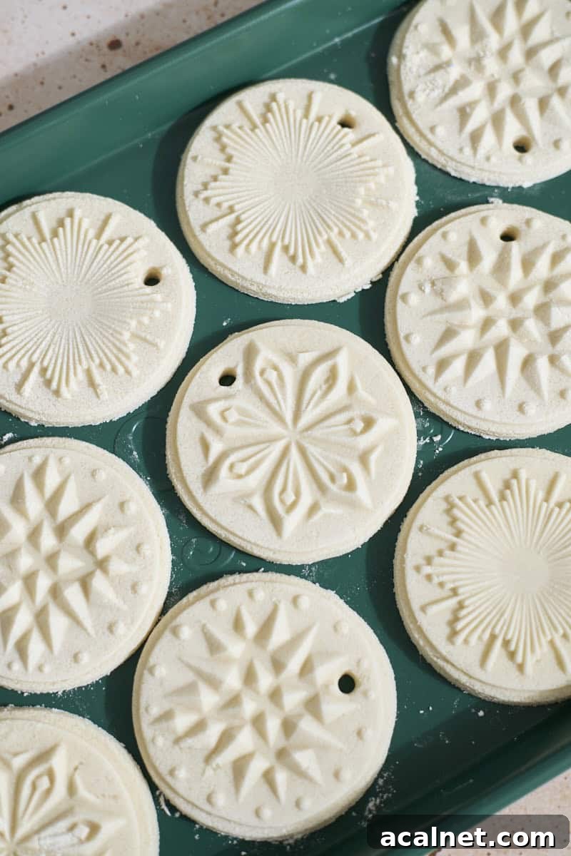 Ornaments drying on a baking sheet.