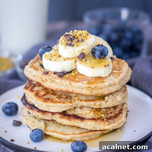 Blueberry Banana Pancakes recipe with oats topped with banana
