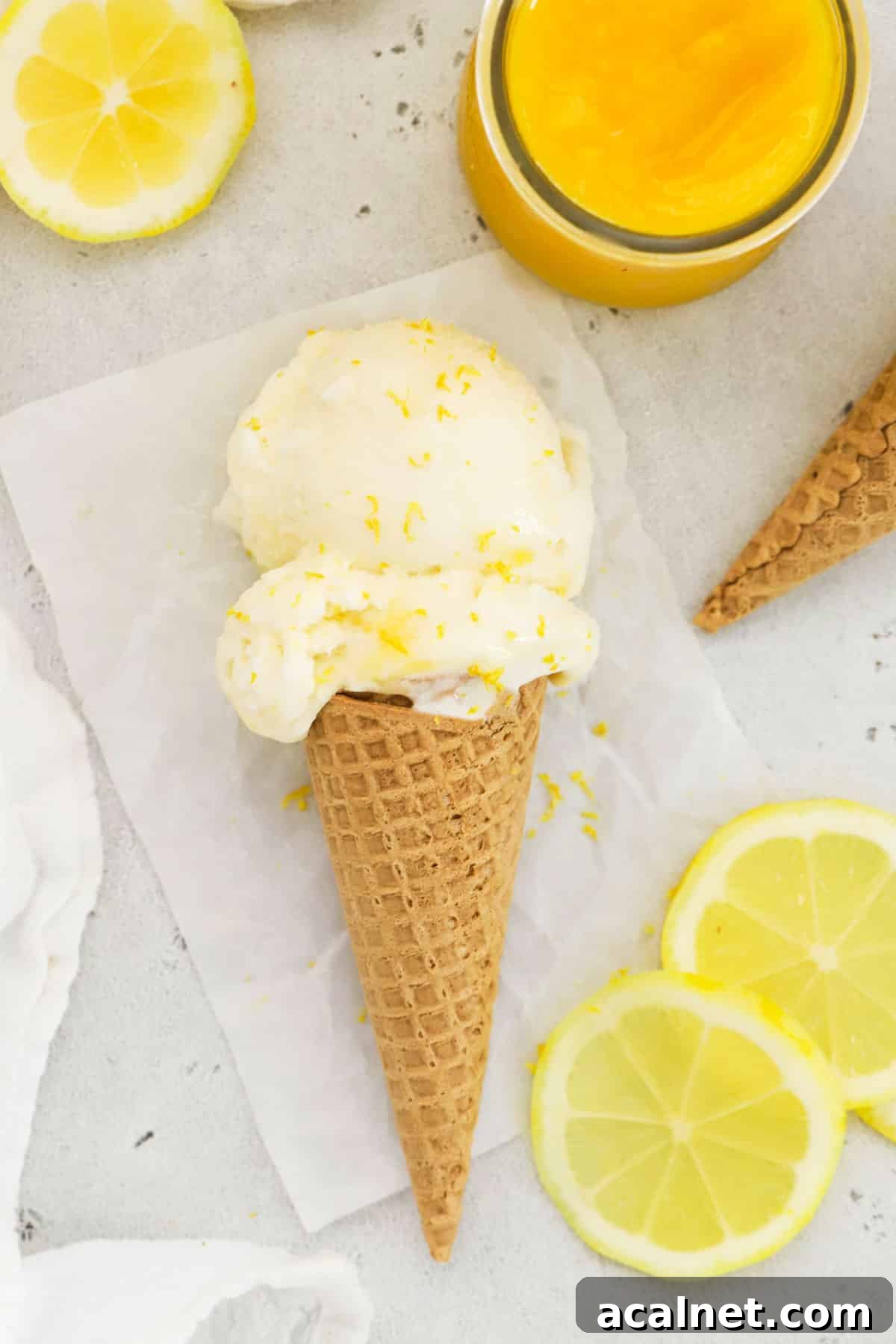 Lemon Ice Cream Swirled with Tangy Lemon Curd 9 homemade lemon ice cream on a gluten-free waffle cone