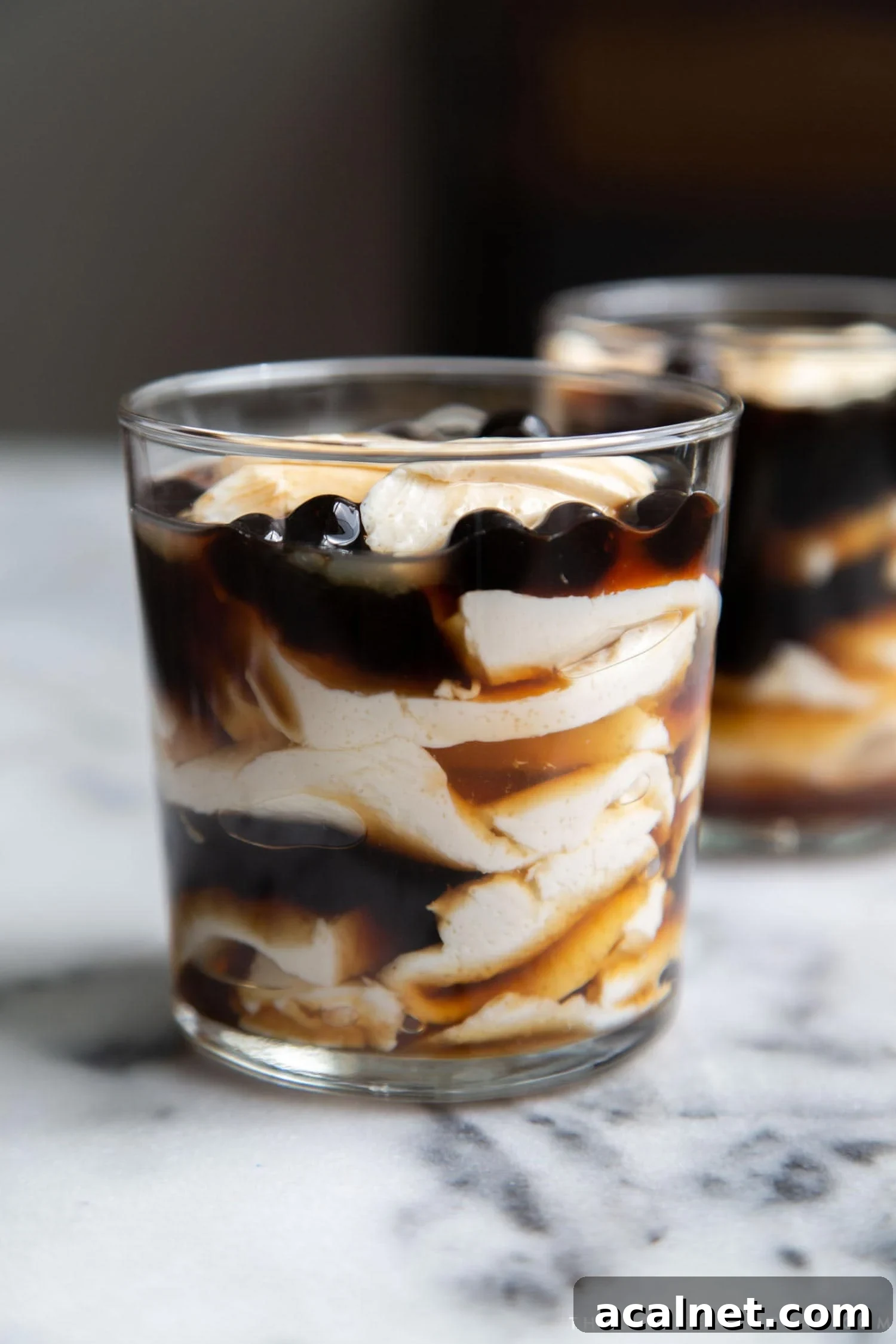 Taho: Classic Filipino Sweet Tofu Dessert 4 Taho. Layered sweet dessert consisting of silken tofu, arnibal, and tapioca balls