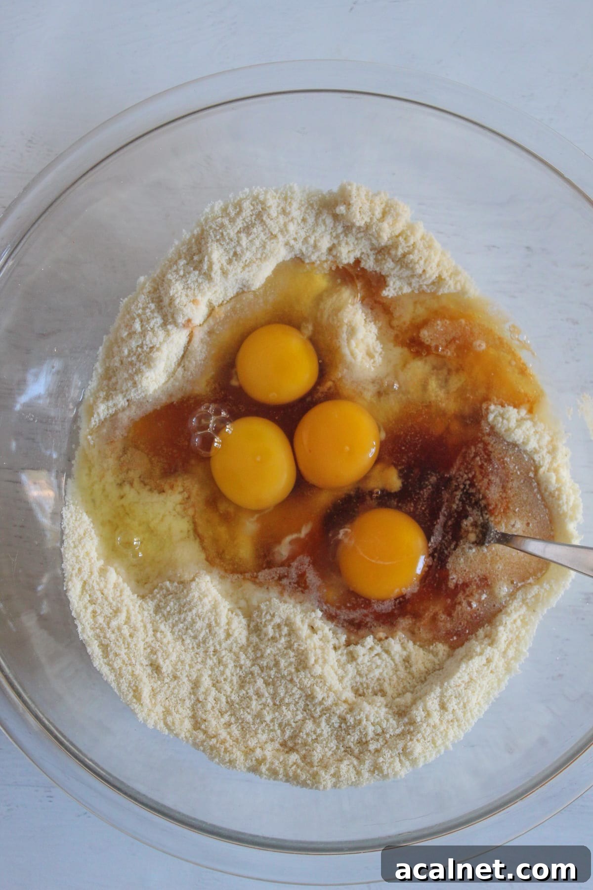 eggs added to dry ingredients in a bowl