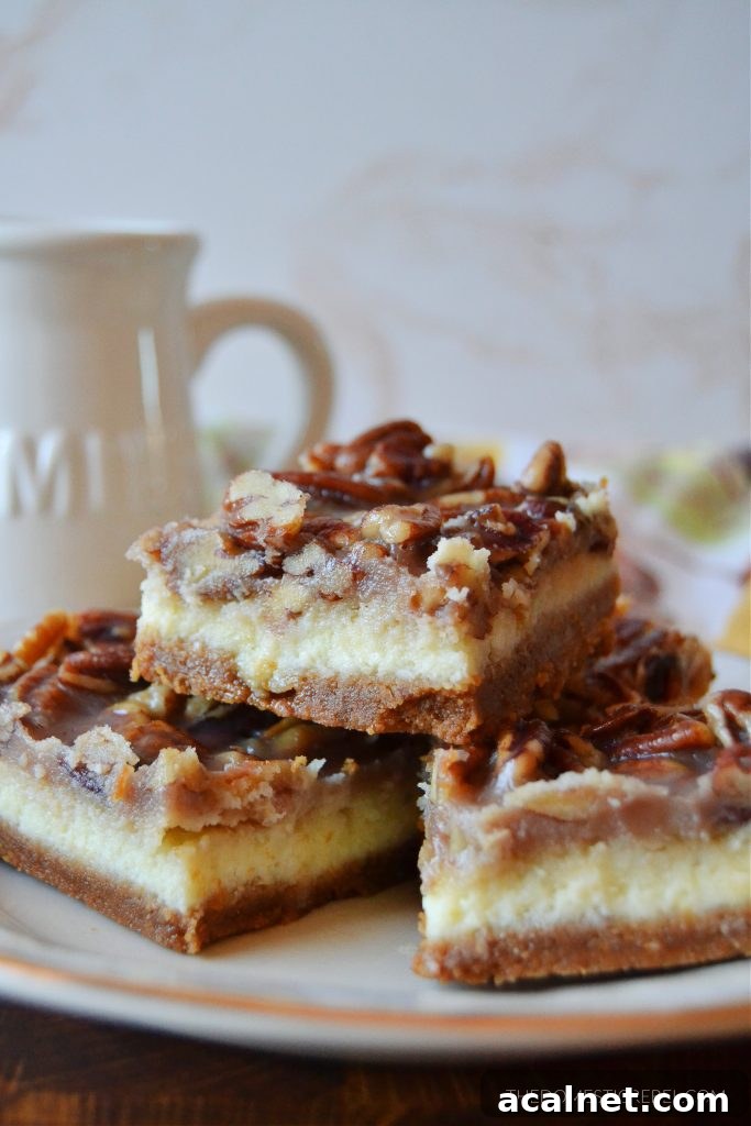 Pecan Pie Cheesecake Bars Recipe 5 a trio stack of pecan pie cheesecake bars on a gold-rimmed plate. a milk jug is in the background.